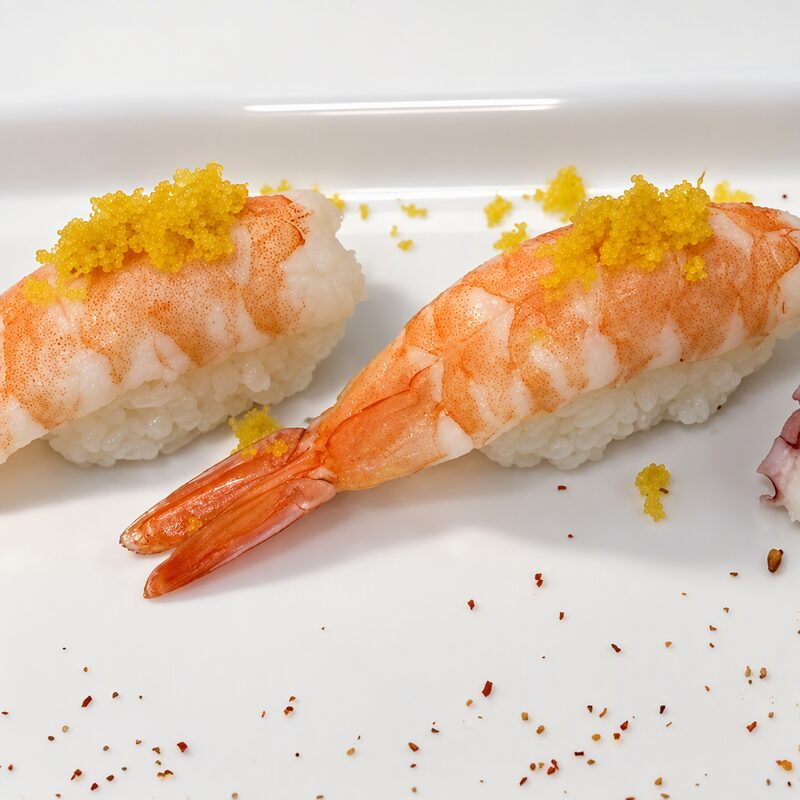 Shrimp nigiri topped with tobiko
