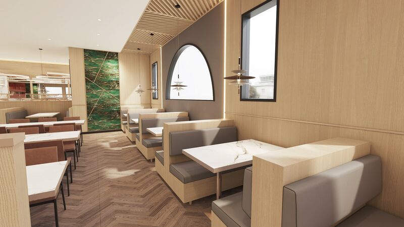 Booth seating under an arched window